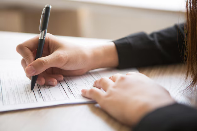 cropped-view-woman-filling-application-form_1262-2110